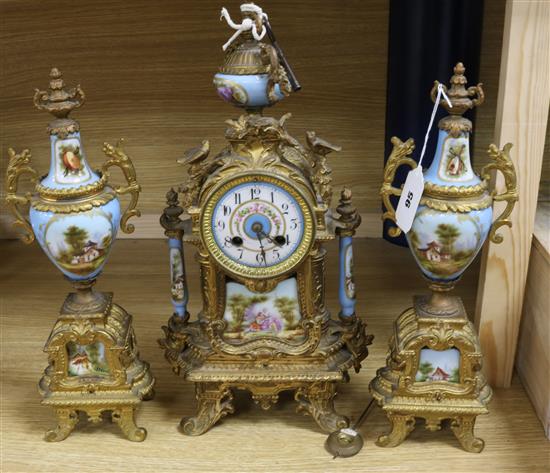 A French gilt metal and porcelain clock garniture clock height 42cm